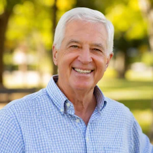 smiling senior in sunlit park